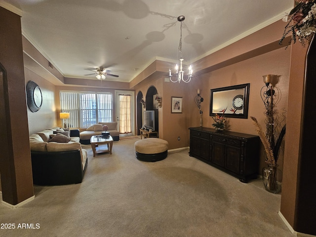 living room with light carpet, crown molding, a tray ceiling, and ceiling fan