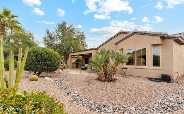 back of property with a patio area