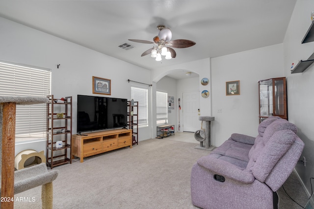 living room featuring ceiling fan and carpet flooring