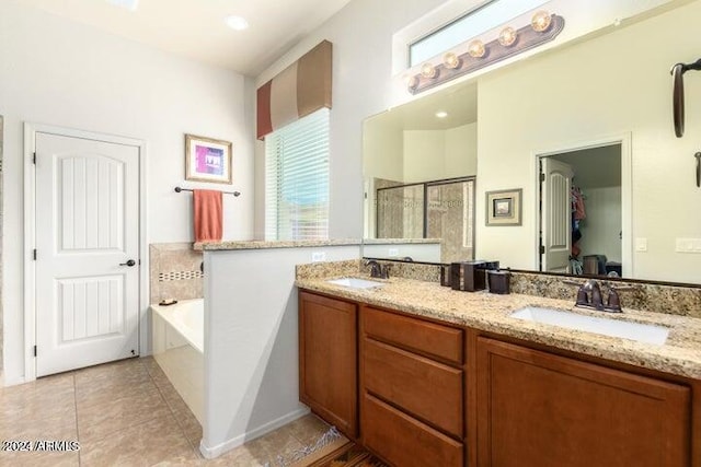 full bath featuring double vanity, a stall shower, a garden tub, and a sink