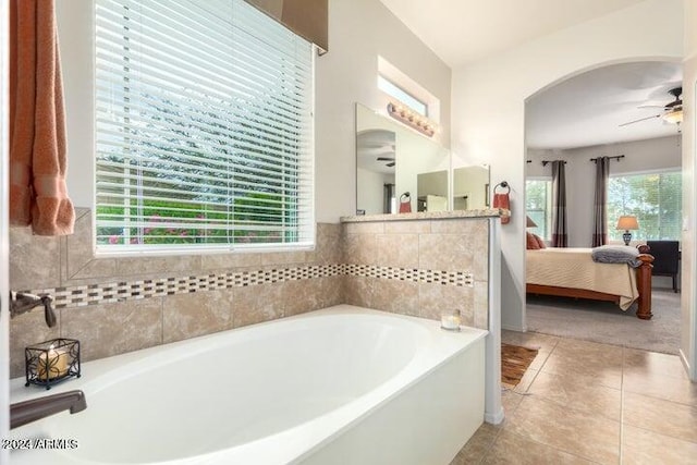 bathroom featuring a garden tub, tile patterned flooring, connected bathroom, and a ceiling fan