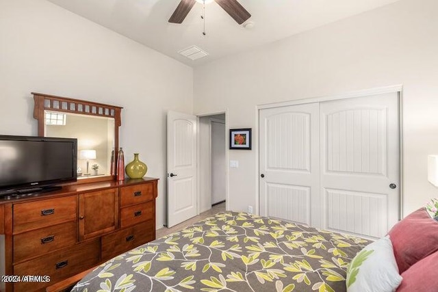 bedroom featuring ceiling fan and a closet