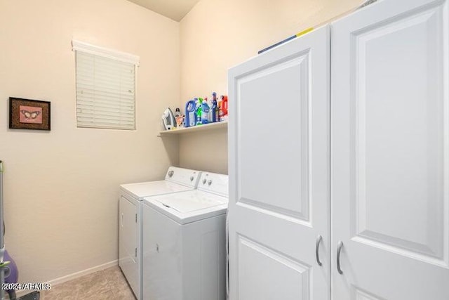 washroom with laundry area, light tile patterned floors, baseboards, and separate washer and dryer