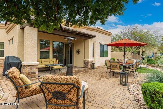 view of patio / terrace with outdoor dining area, an outdoor living space, fence, and grilling area