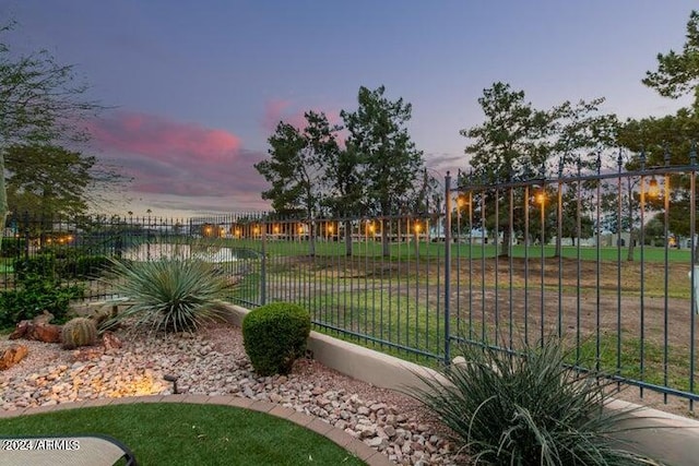 view of property's community featuring fence