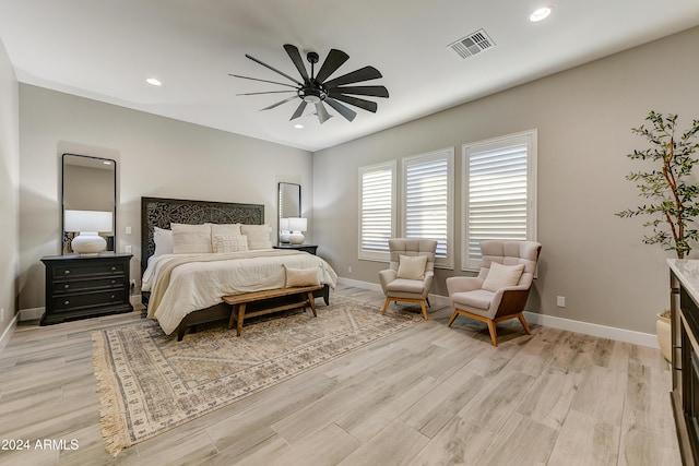 bedroom featuring ceiling fan and light hardwood / wood-style floors