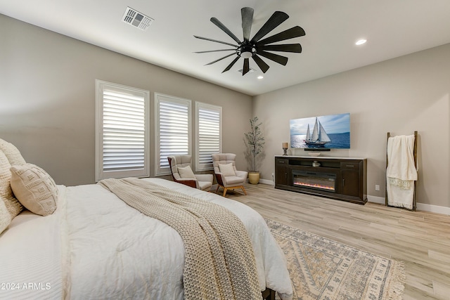 bedroom featuring ceiling fan and light hardwood / wood-style flooring