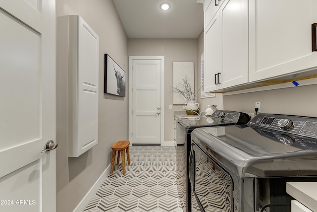 laundry area with cabinets and independent washer and dryer