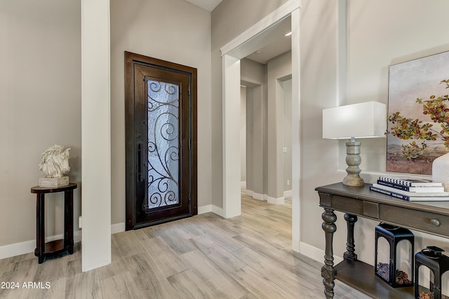 foyer entrance with light wood-type flooring