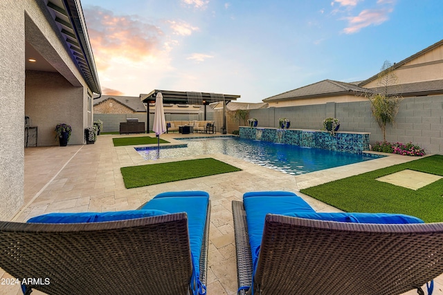 view of pool with pool water feature, a patio area, an outdoor hangout area, and a pergola