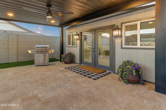 doorway to property featuring ceiling fan, a patio, and french doors