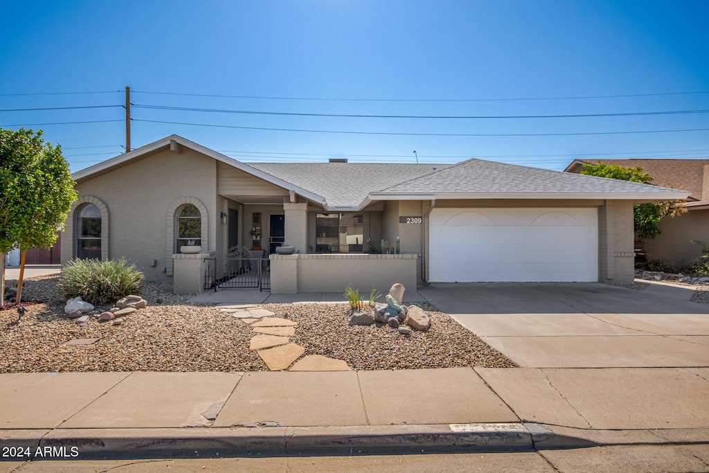 ranch-style home with a garage