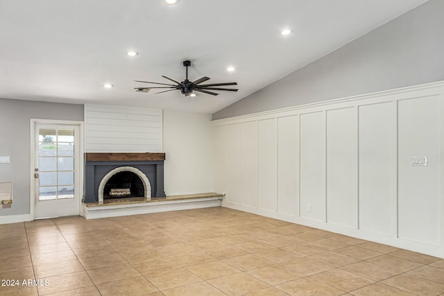 unfurnished living room featuring lofted ceiling, light tile patterned floors, and ceiling fan