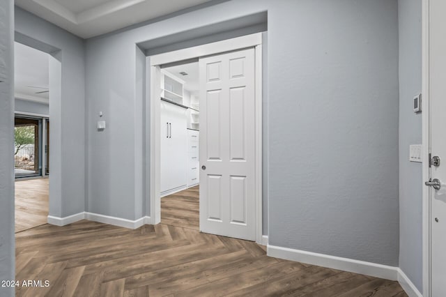 hall with dark parquet floors