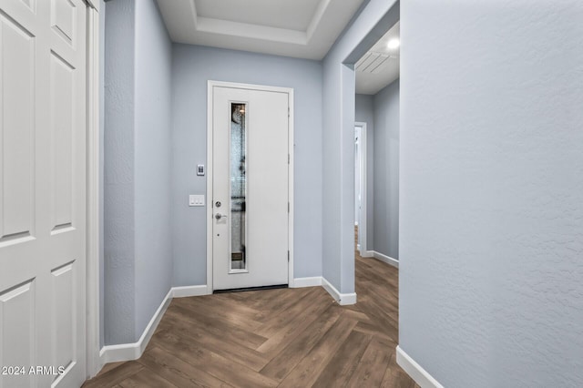 doorway featuring dark parquet floors