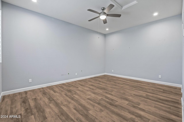 unfurnished room with dark wood-type flooring