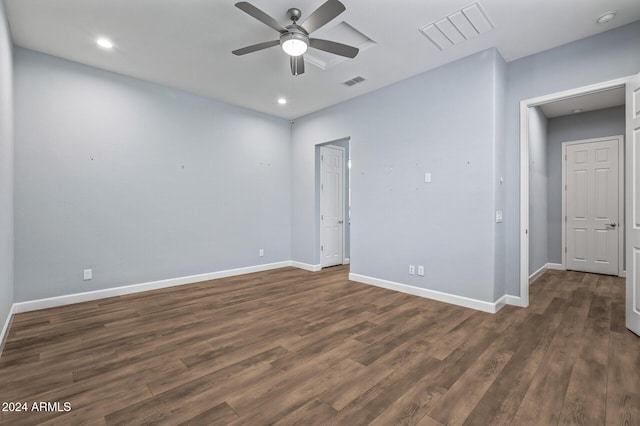 spare room featuring dark hardwood / wood-style floors and ceiling fan