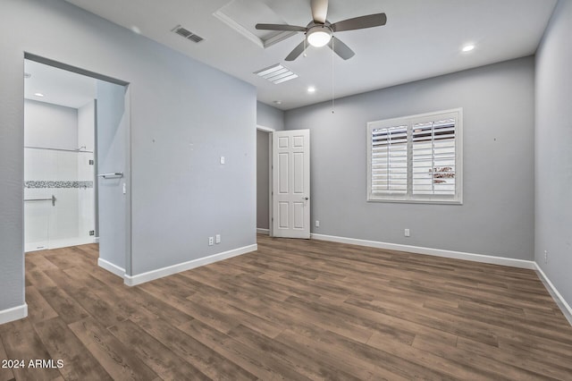 unfurnished bedroom with ceiling fan and dark wood-type flooring