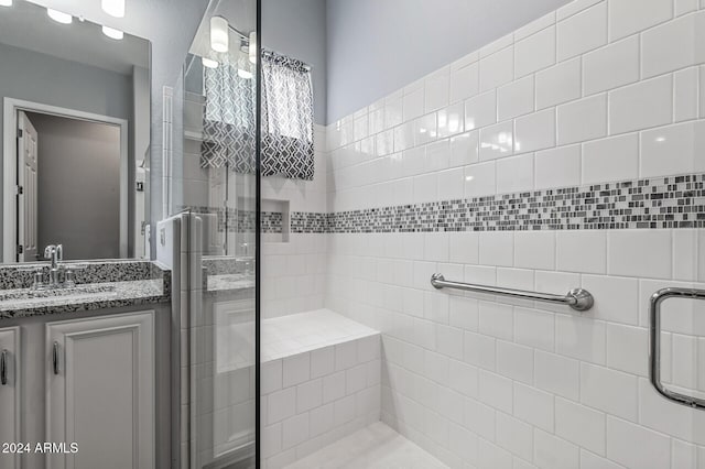 bathroom with vanity and walk in shower