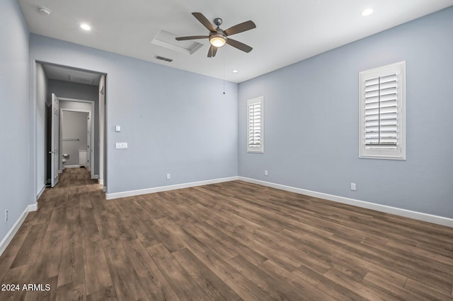 empty room featuring ceiling fan and dark hardwood / wood-style flooring