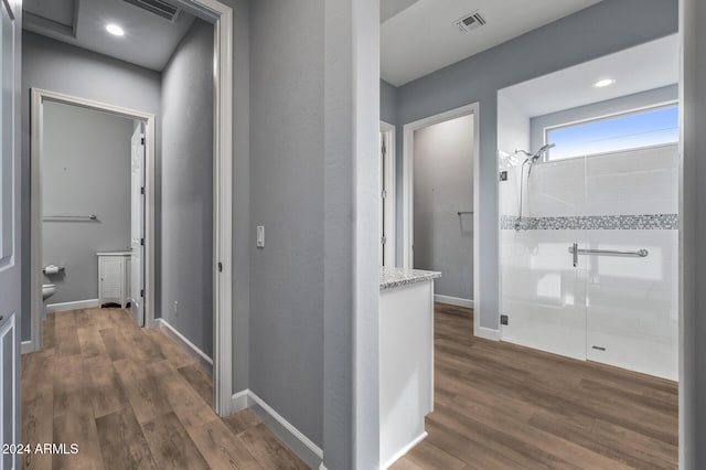 hallway with dark wood-type flooring