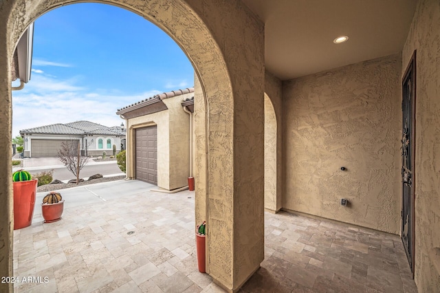 view of patio with a garage