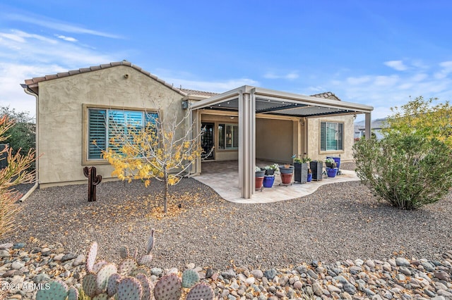 back of house with a patio area