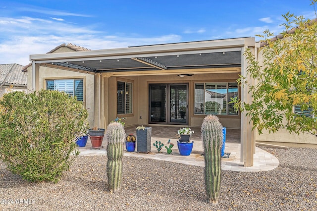 back of property with a patio area