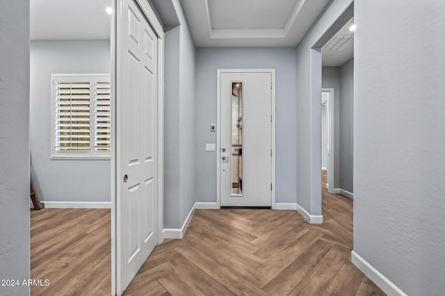 entryway with parquet floors