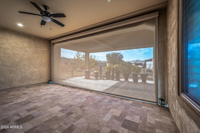 interior space featuring ceiling fan