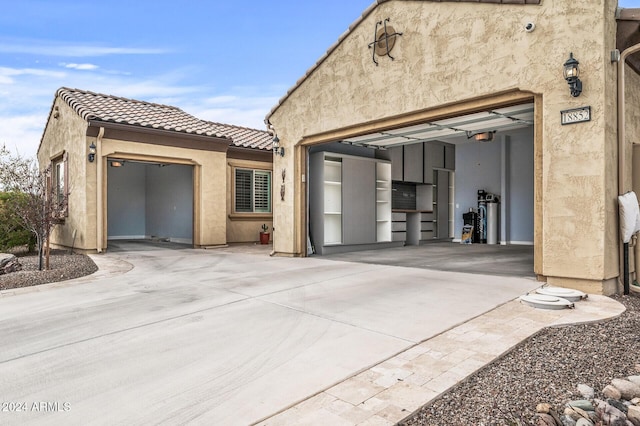 rear view of property with a garage