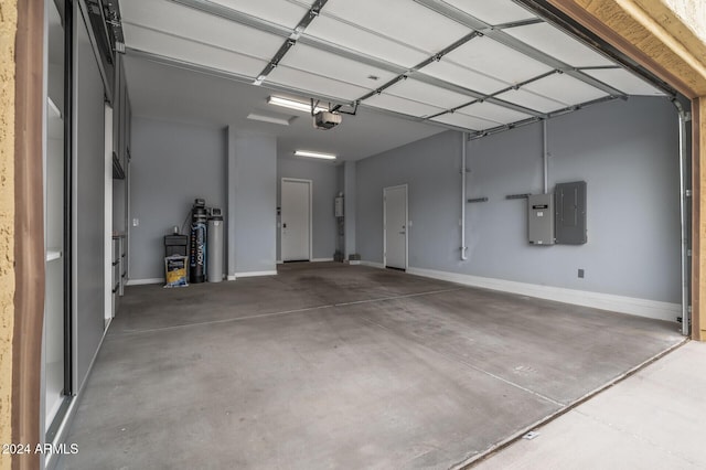 garage with electric panel and a garage door opener