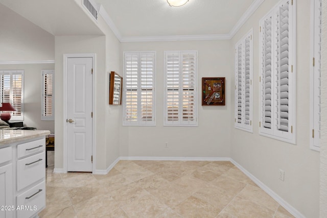 interior space with crown molding