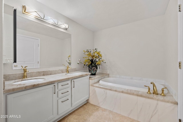 bathroom featuring vanity, a relaxing tiled tub, and tile patterned floors