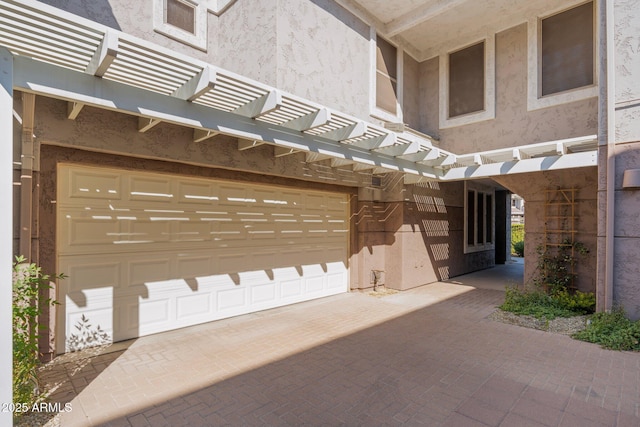 view of gate with a garage