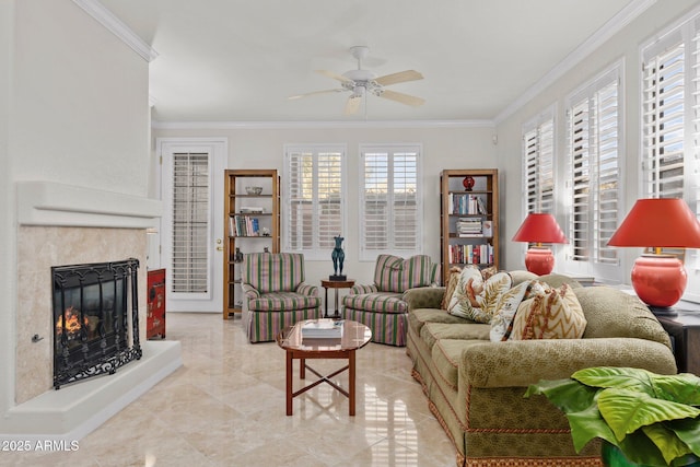 living room featuring crown molding, ceiling fan, and a high end fireplace