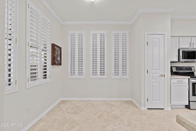 kitchen with white cabinetry, crown molding, and stainless steel appliances