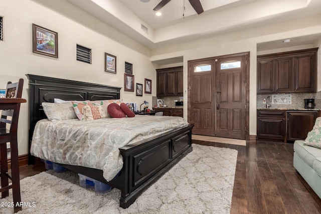 bedroom with dark wood-type flooring and ceiling fan