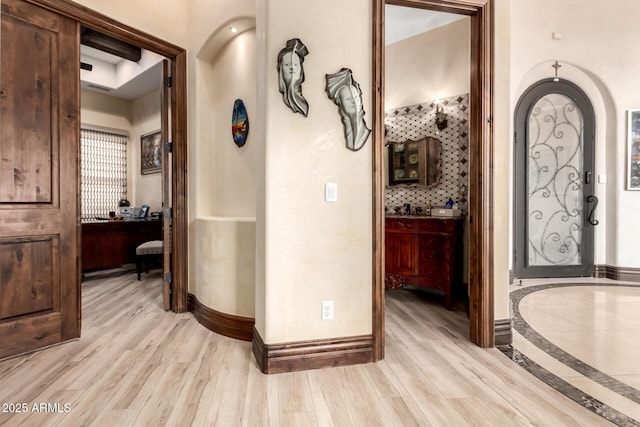 corridor featuring light hardwood / wood-style flooring