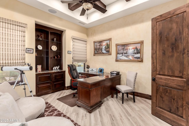 office space featuring ceiling fan and light wood-type flooring