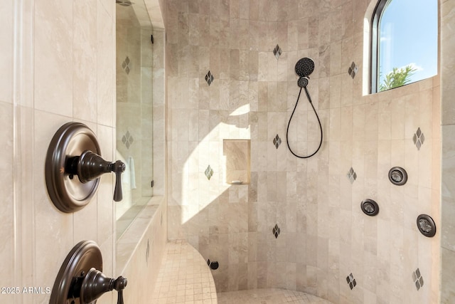 bathroom with a tile shower