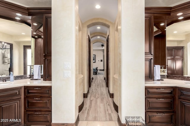 hall featuring sink and light hardwood / wood-style flooring