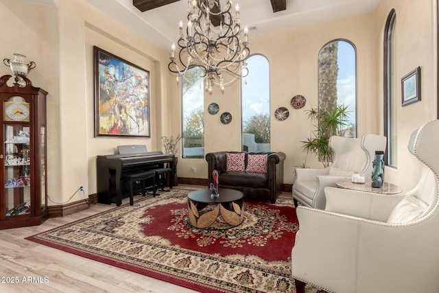 living area featuring hardwood / wood-style floors and a notable chandelier