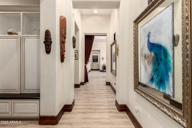 hall with light hardwood / wood-style floors