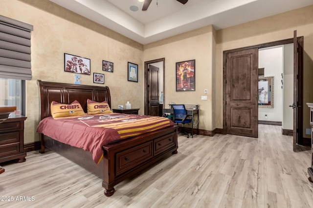 bedroom featuring light hardwood / wood-style flooring and ceiling fan