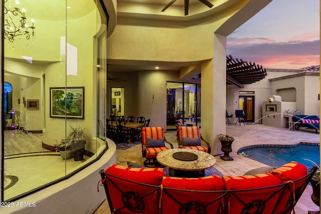 interior space with ceiling fan, outdoor lounge area, and a pergola