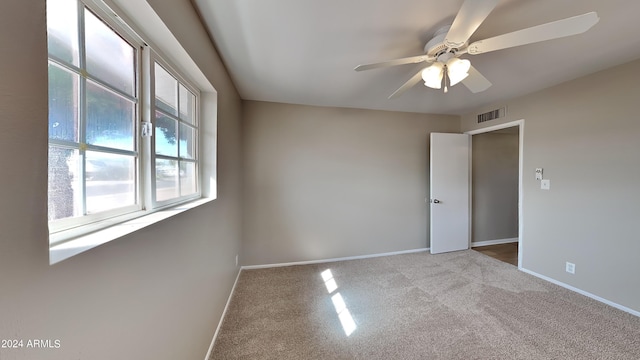 carpeted empty room with ceiling fan