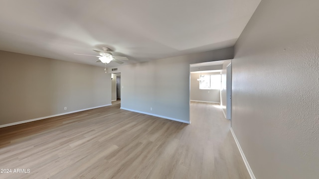 spare room featuring light hardwood / wood-style floors and ceiling fan