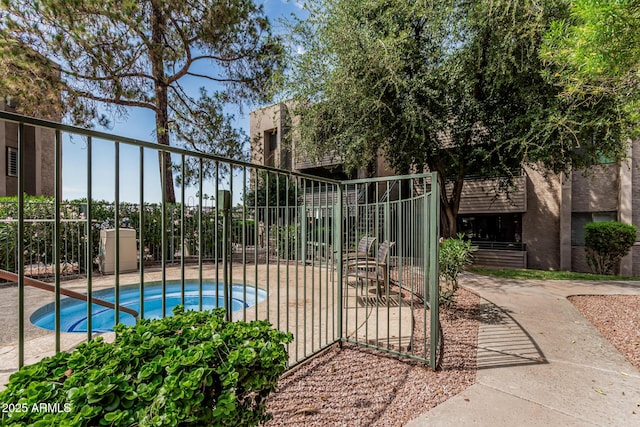 7777 E Main St Unit 143, Scottsdale, AZ 85251 - view of pool with a hot tub