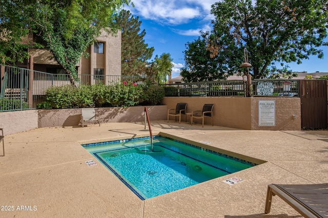 7777 E Main St Unit 143, Scottsdale, AZ 85251 - view of swimming pool featuring a patio area, a hot tub, and a swimming pool